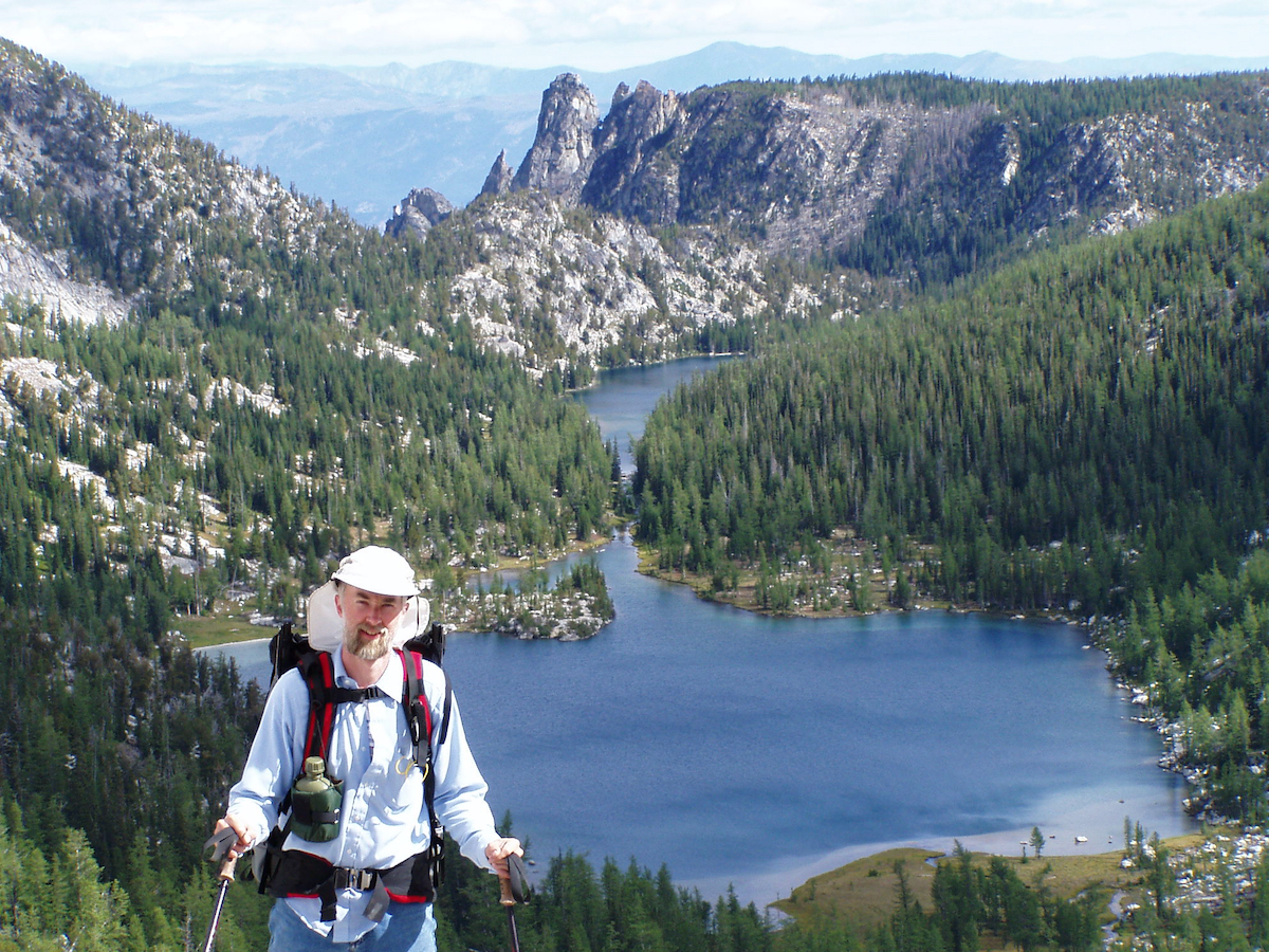 Larry with lake and distant mesa beyond