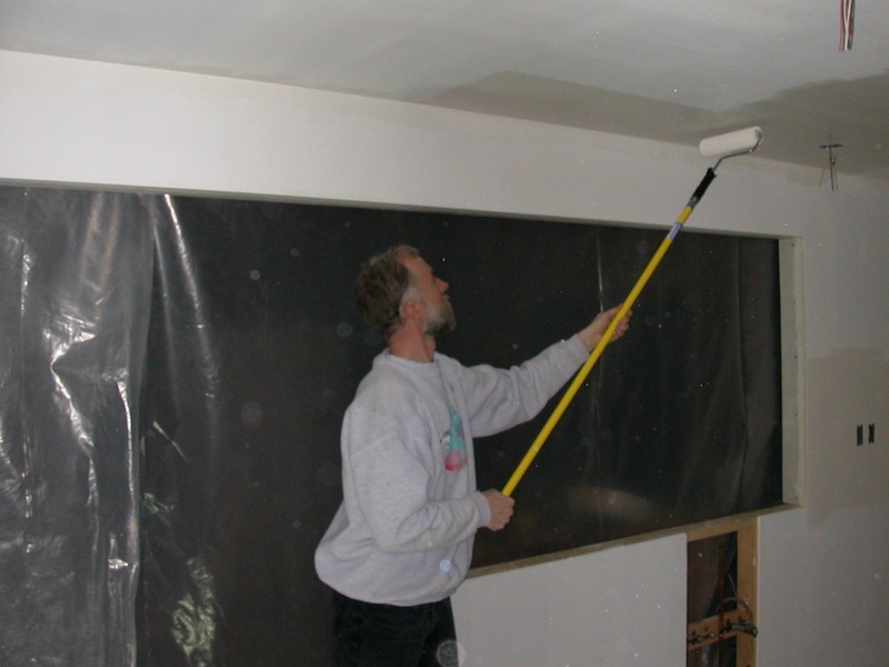 Larry painting with roller