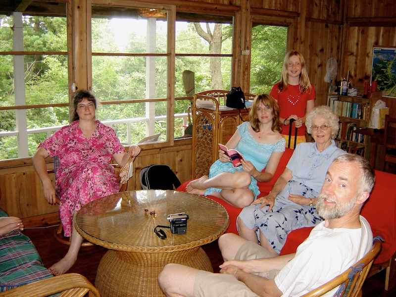 inside cabin, wood walls, wicker funiture