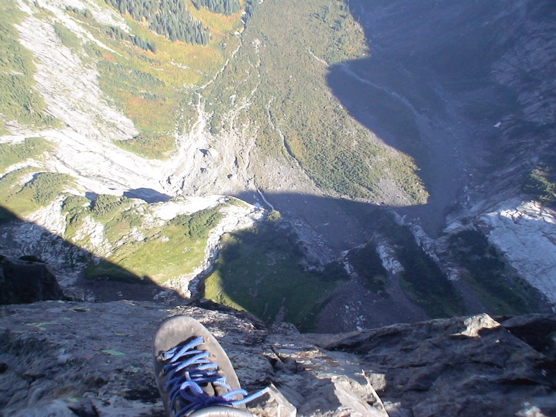 hiking boot with valley below