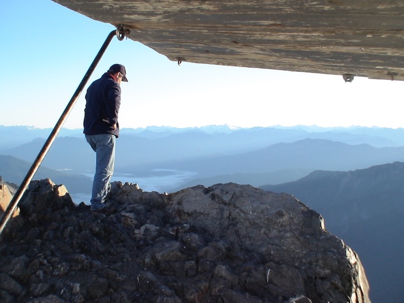 person standing on rocky back porch