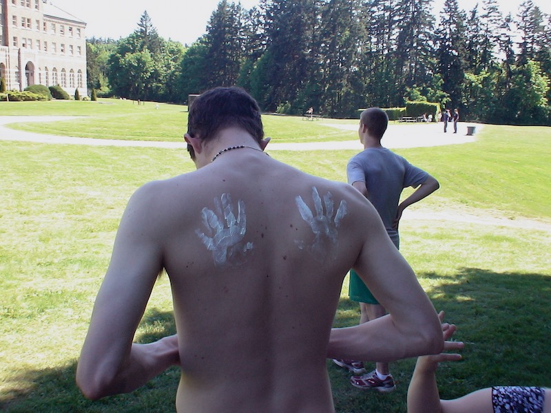 Sunscreen slapped on a back