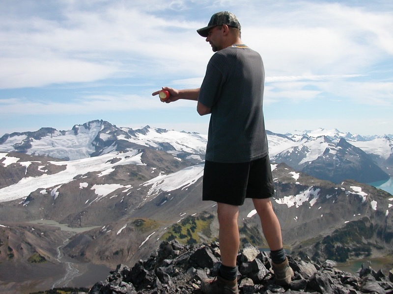 David standing at top eating apple
