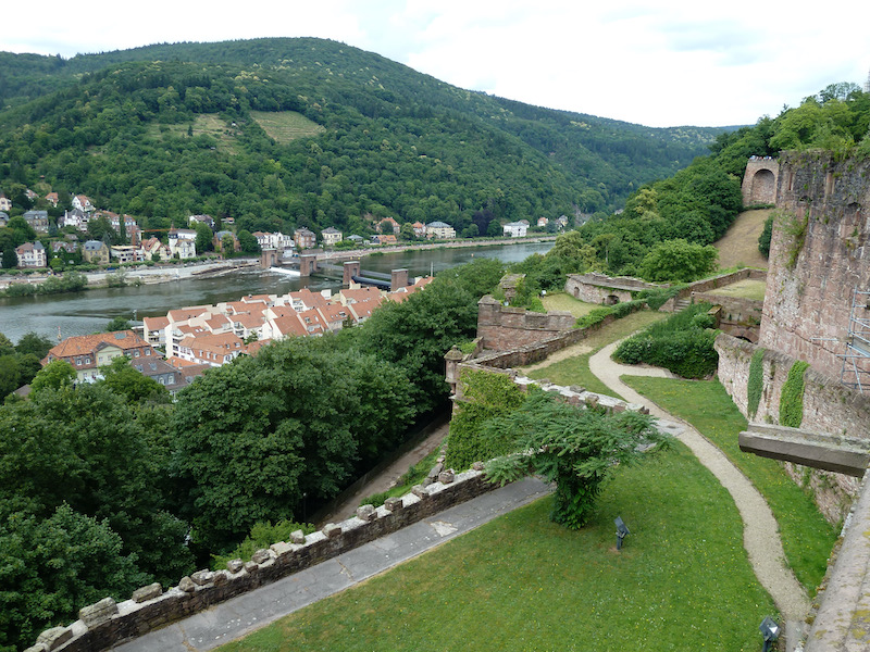 Trees up valley, dam on river, castle fields
