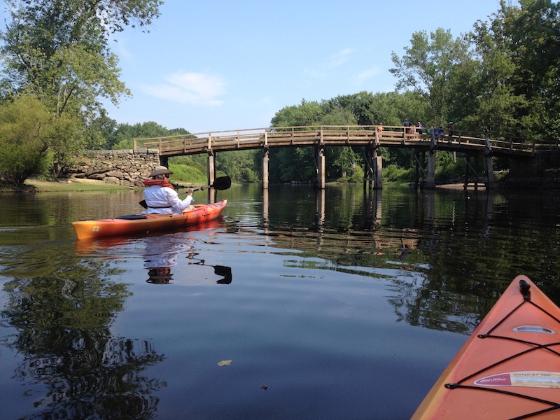 Melanie approaching wooden bridge