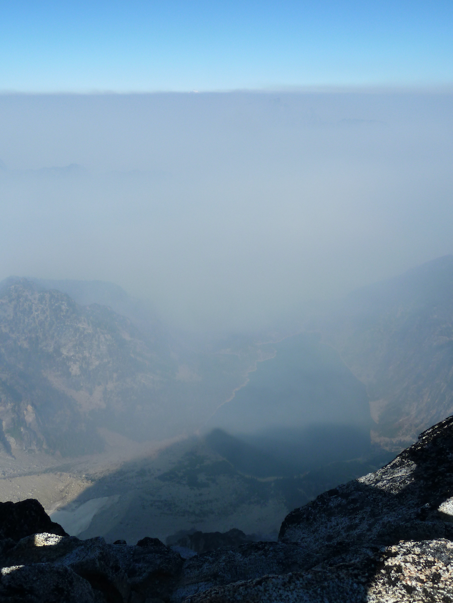 looking down on Colchuck but barely visible through smoke