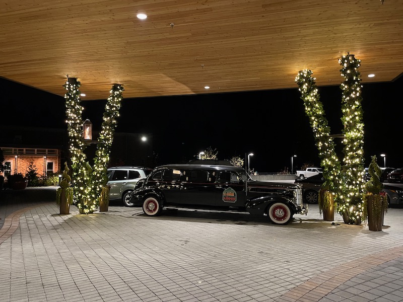 limousine under covered driveway