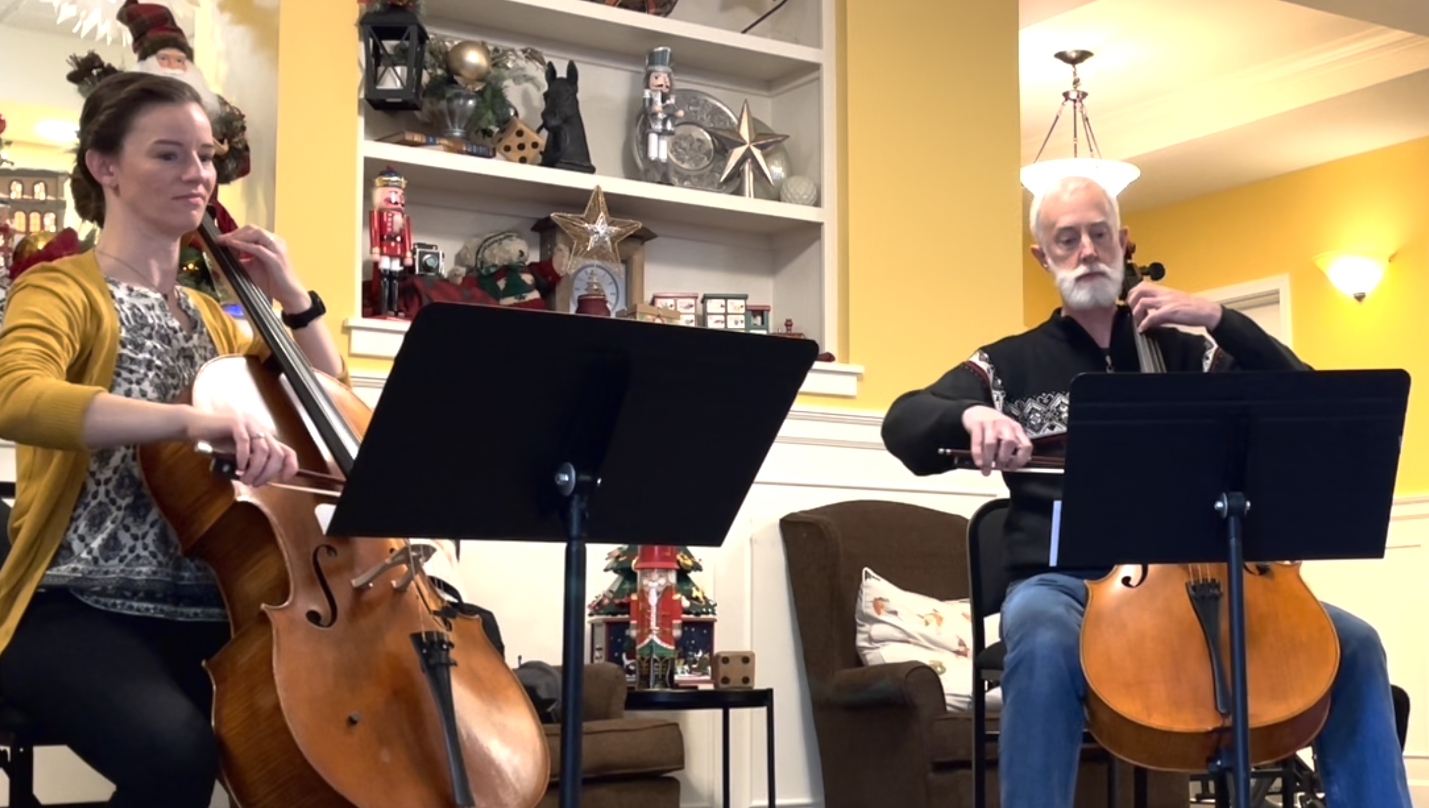 two cellists in performance
