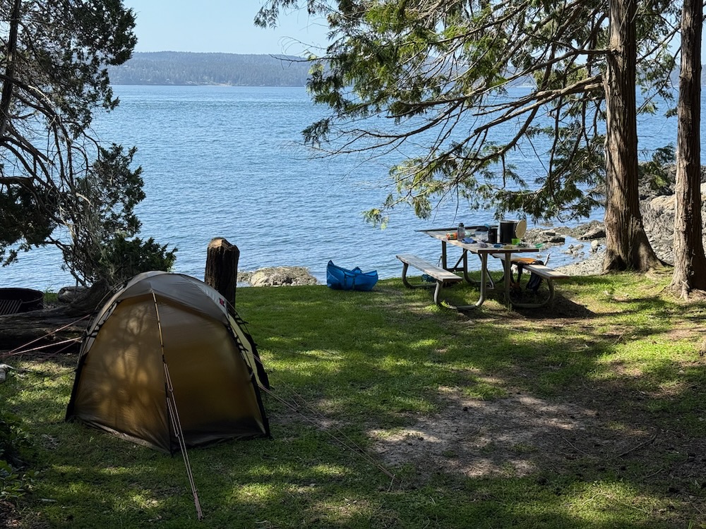 camp with water beyond