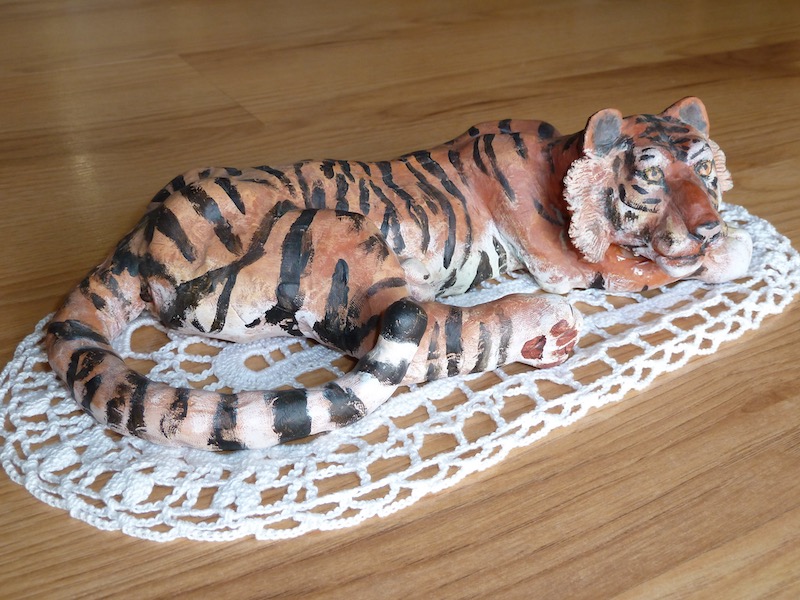 Tiger reclining, from tail