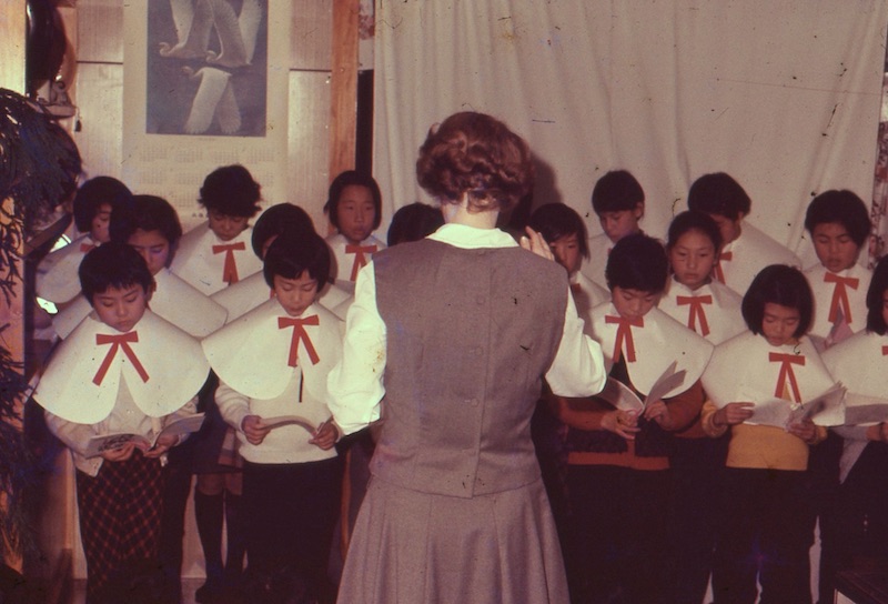 Carolyn leading choir at Christmas