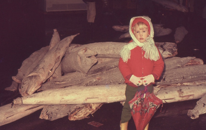 Lisa standing in front of frozen swordfish